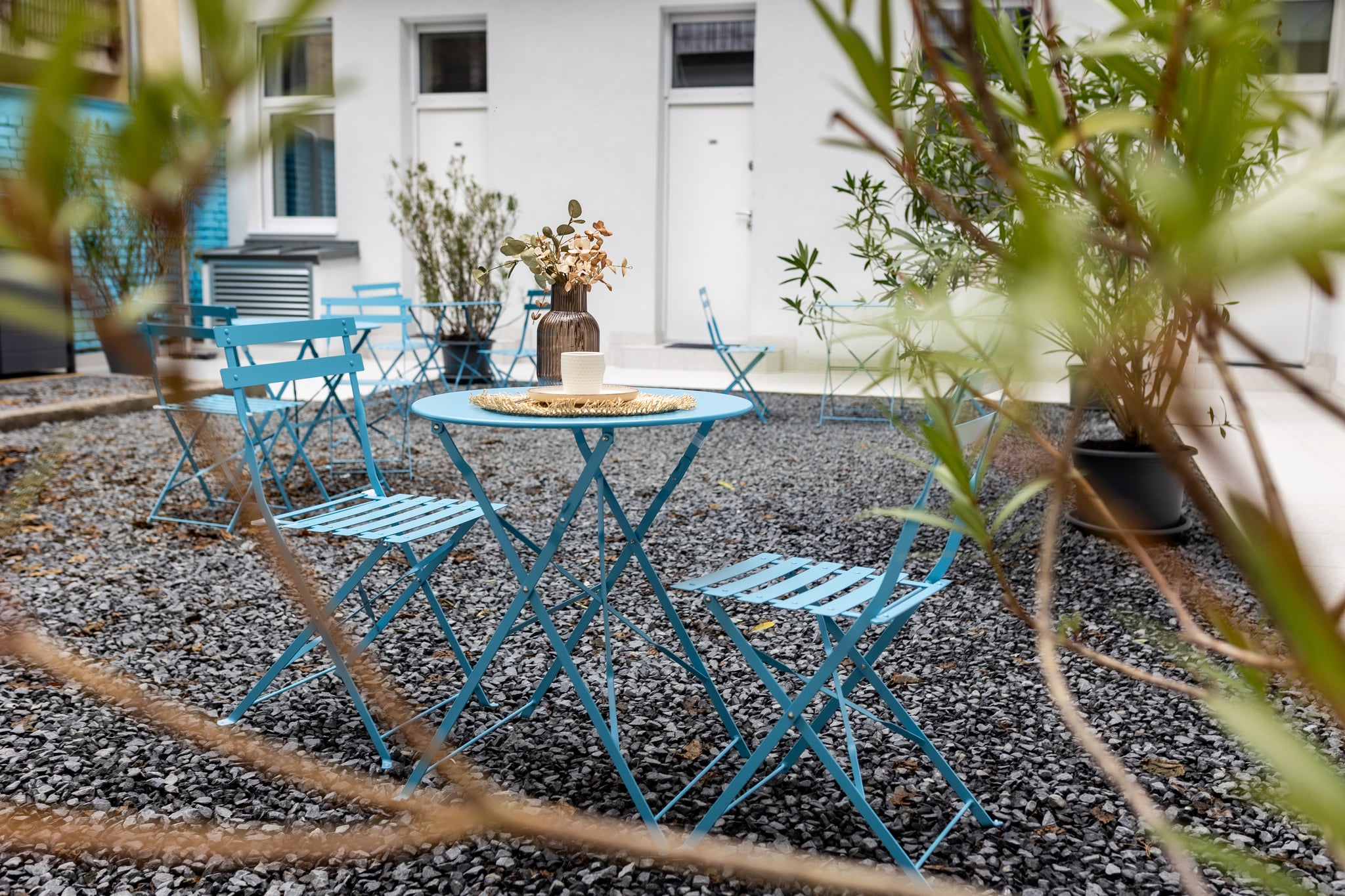 Bistro tables and chairs on the courtyard patio