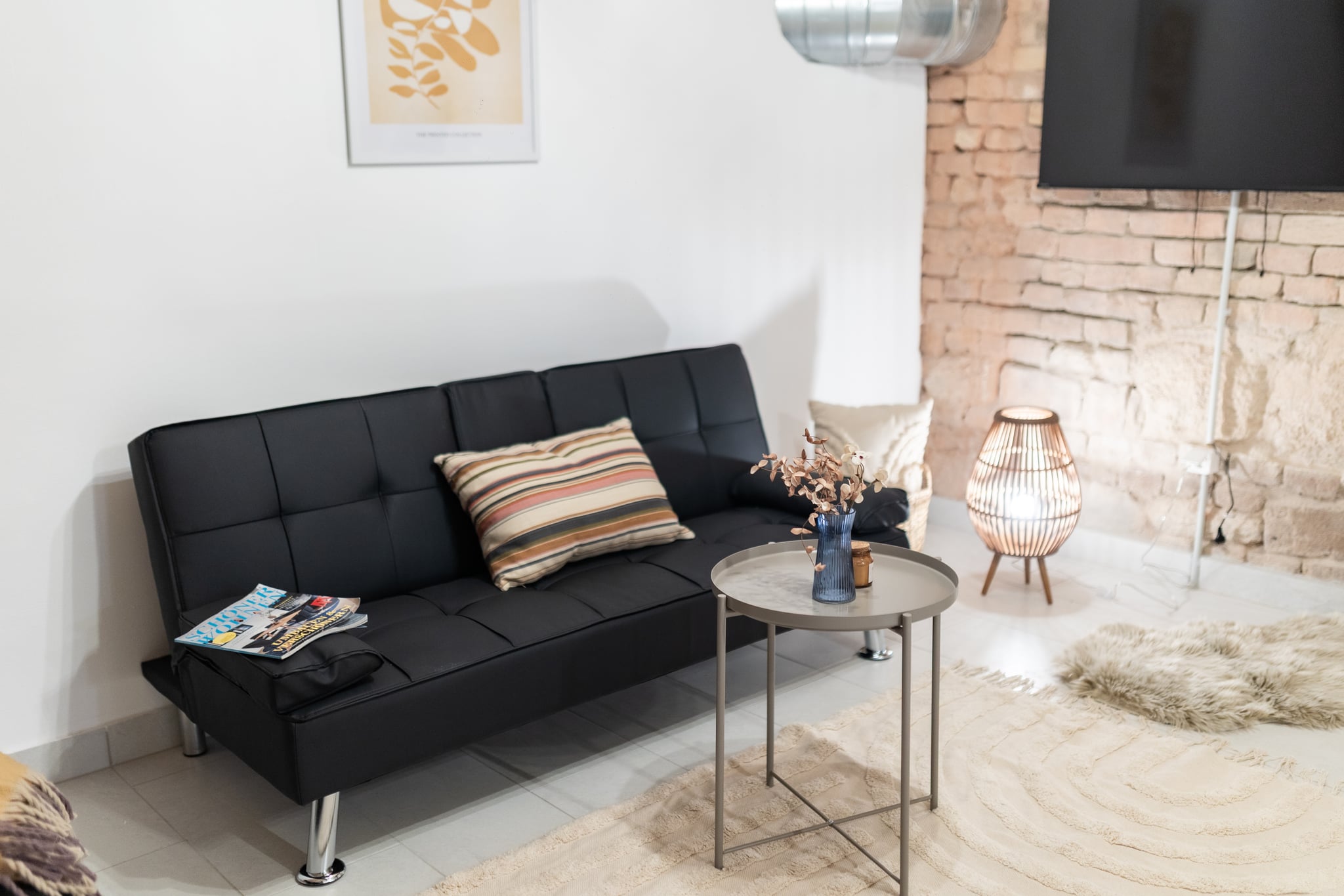 The residents' lounge, with sofas and a television